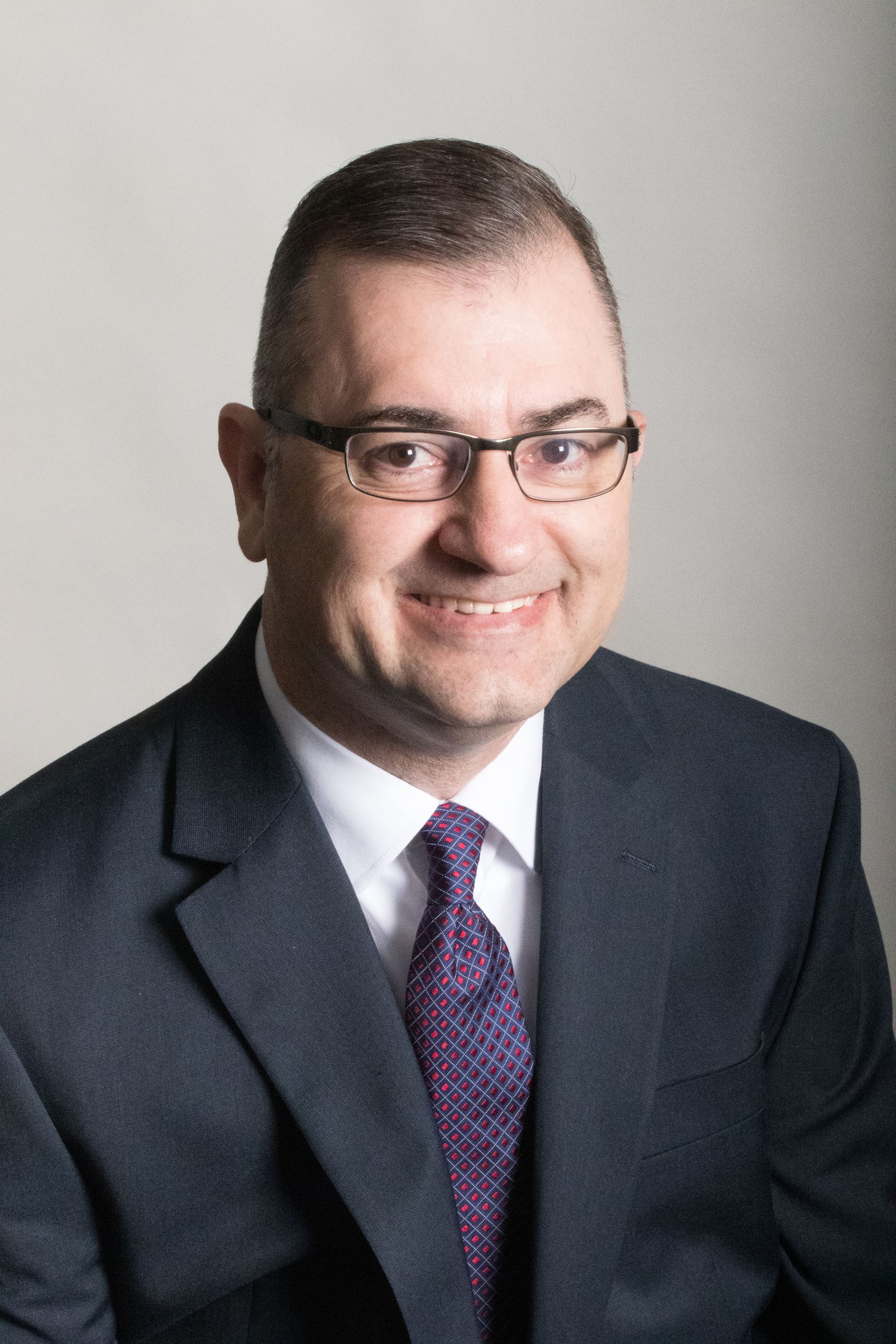 A photo of the community development director, Brian Billingsley. A white male with dark hair and gl